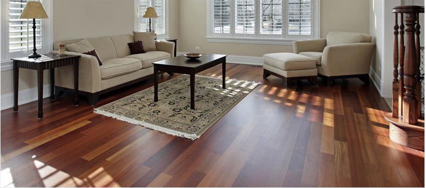A living room with a wood flooring threshold